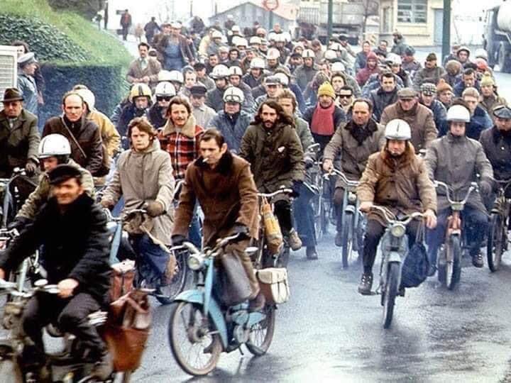 French workers on Mobylettes
