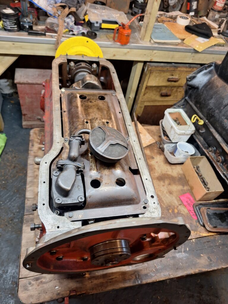 Oil pump, pickup strainer and baffle plate fitted