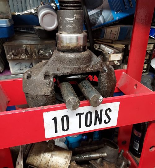Right hand caliper being freed off with help from the press